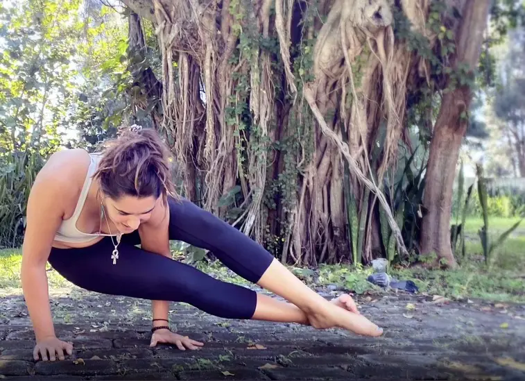 Carolina doing backyard yoga handstand